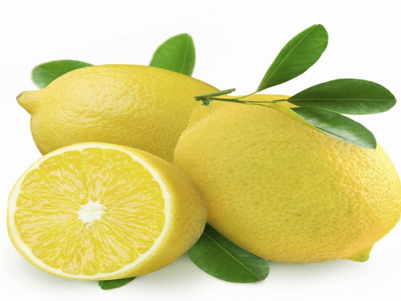 обои Два лимона с половинкой фото
