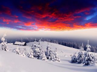 обои Зимние горы под красноватым небом фото