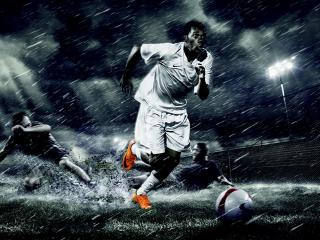 обои Рисунок футбольной игры в дождливyю погоду фото