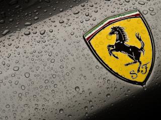 обои Логотип Ferrari в каплях воды фото