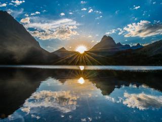 обои Исчезающий диск солнца над озером фото
