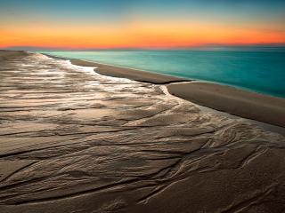 обои Мокрый песок спокойного океана фото