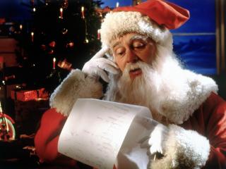 обои для рабочего стола: Санта читает список подарков