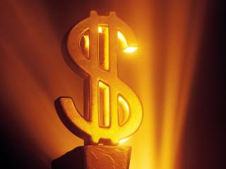 обои Золотая статуя доллара в свете прожектора фото