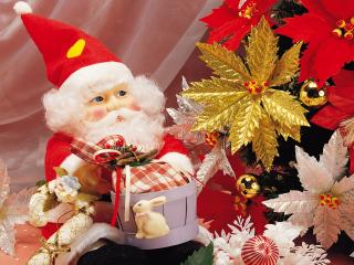 обои Санта-клаус с мешком подарков рядом с елкой фото