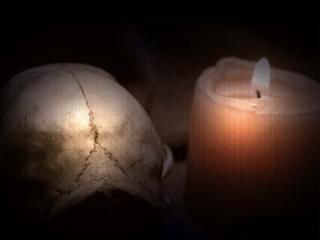 обои Череп и свеча фото