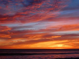 обои Красочный оранжевый закат над морем фото