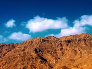 обои Песчаные скалы под голубым облачным небом фото