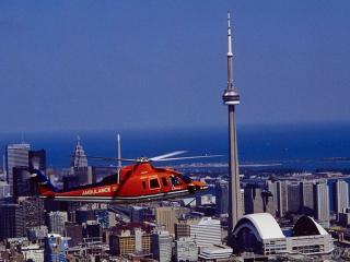 обои Красный вертолет над мегаполисом фото