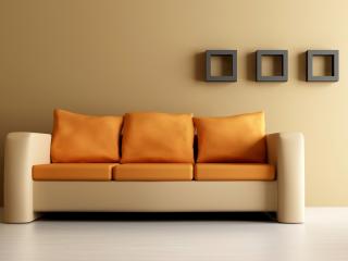 обои Диван с оранжевыми подушками у стены фото