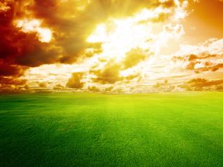обои Окрашенные облака над зеленым ковром полей фото
