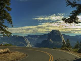 обои Круглый поворот дороги в горах фото
