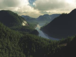 обои Горы густо покрытые лесами и река внизу фото